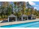 View of the community pool with cabanas and lounge seating for residents at 529 Azalea Bloom Dr, Loganville, GA 30052