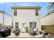 Exterior showcasing a patio, backyard and tidy landscaping at 6454 Grey Fox Way, Riverdale, GA 30296