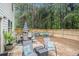 Fenced backyard boasting patio furniture, grass and an inviting atmosphere at 6454 Grey Fox Way, Riverdale, GA 30296
