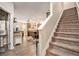 Inviting foyer featuring staircase and an open floor plan leading to living spaces at 6454 Grey Fox Way, Riverdale, GA 30296