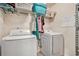 Practical laundry room featuring a washer, dryer, and storage space at 6454 Grey Fox Way, Riverdale, GA 30296