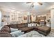 Open-concept living room seamlessly connecting to dining area and kitchen, perfect for entertaining at 6454 Grey Fox Way, Riverdale, GA 30296