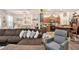 Spacious living room flowing into the dining area and kitchen, promoting a bright and airy atmosphere at 6454 Grey Fox Way, Riverdale, GA 30296