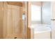 Bathroom showcasing a glass-enclosed shower and a luxurious soaking tub for relaxation at 1008 Walnut Creek Dr, Woodstock, GA 30188