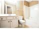 Bright bathroom features white vanity, toilet, and tub/shower combination with updated fixtures at 1008 Walnut Creek Dr, Woodstock, GA 30188