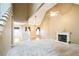 Bright living room showcases soaring ceilings, fireplace, plush carpet, and open floorplan at 1008 Walnut Creek Dr, Woodstock, GA 30188