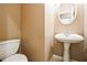 Charming powder room featuring a pedestal sink and classic fixtures at 1008 Walnut Creek Dr, Woodstock, GA 30188