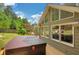 Spacious back deck featuring a modern hot tub, offering a peaceful retreat and picturesque views of the backyard at 1050 Chestnut Hill Sw Cir, Marietta, GA 30064