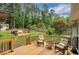 Inviting back deck with outdoor seating and a clear view of the backyard fire pit and entertainment area at 1050 Chestnut Hill Sw Cir, Marietta, GA 30064