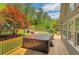 Inviting back deck with a relaxing hot tub, perfect for outdoor entertaining and enjoying the serene backyard at 1050 Chestnut Hill Sw Cir, Marietta, GA 30064