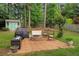 Backyard featuring a cozy fire pit area and outdoor seating, ideal for gatherings and relaxation at 1050 Chestnut Hill Sw Cir, Marietta, GA 30064