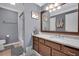 Clean, updated bathroom with vanity, marble countertop, framed mirror and a shower and tub combo at 1050 Chestnut Hill Sw Cir, Marietta, GA 30064