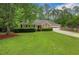 Lovely brick home with neatly trimmed bushes and a beautifully landscaped front yard at 1050 Chestnut Hill Sw Cir, Marietta, GA 30064