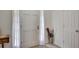 Bright entryway features a white front door flanked by sheer curtains, and neutral tile flooring at 1050 Chestnut Hill Sw Cir, Marietta, GA 30064