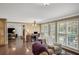 Open living area with hardwood floors, a fireplace, and a view of the backyard at 1050 Chestnut Hill Sw Cir, Marietta, GA 30064