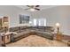 Spacious living room with a vaulted ceiling, hardwood floors, and an oversized sofa at 1050 Chestnut Hill Sw Cir, Marietta, GA 30064