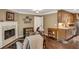Cozy living room featuring a fireplace, hardwood floors, and access to the kitchen at 1050 Chestnut Hill Sw Cir, Marietta, GA 30064