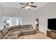 Comfortable living room with plush sectional sofa, ceiling fan and neutral decor at 1050 Chestnut Hill Sw Cir, Marietta, GA 30064