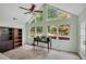 Bright sunroom with large windows, ceiling fan, and table, perfect for plants and relaxation at 1050 Chestnut Hill Sw Cir, Marietta, GA 30064