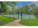 A fenced tennis court for residents' enjoyment at 1050 Chestnut Hill Sw Cir, Marietta, GA 30064
