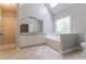 Bright primary bathroom featuring a double vanity, shower, and tub under a skylight at 2950 Camary Place Se Dr, Conyers, GA 30094