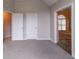 Spacious bedroom with neutral carpeting featuring a vaulted ceiling and entry doors at 2950 Camary Place Se Dr, Conyers, GA 30094