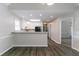 Small kitchen with recessed lighting, white cabinets, and wood-look flooring at 2950 Camary Place Se Dr, Conyers, GA 30094