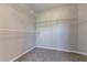 Walk-in closet with carpeted floor and multiple white wire rack shelves at 2950 Camary Place Se Dr, Conyers, GA 30094