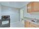 Basement kitchenette featuring appliances, cabinets, and sink at 3238 Sharp Creek Ln, Buford, GA 30519