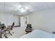 Bedroom showing neutral carpet, a ceiling fan and an open door to the kitchen at 3238 Sharp Creek Ln, Buford, GA 30519