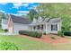 Charming single-Gathering home with a well-manicured lawn, inviting front porch, and attached garage at 3238 Sharp Creek Ln, Buford, GA 30519