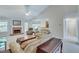 Spacious living room featuring a brick fireplace, neutral paint, and ample natural light from large windows at 3238 Sharp Creek Ln, Buford, GA 30519