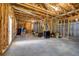 Unfinished basement area with exposed wood beams and concrete floor offers potential for customization at 416 Wilfawn Way, Avondale Estates, GA 30002