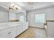 Bright bathroom featuring tile floor, separate vanities, stone accents, and natural lighting at 416 Wilfawn Way, Avondale Estates, GA 30002