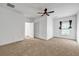 Bright bedroom featuring neutral carpeting, ceiling fan, and a window for natural light at 416 Wilfawn Way, Avondale Estates, GA 30002