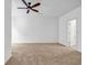 Spacious bedroom featuring neutral carpeting, a ceiling fan, and natural light at 416 Wilfawn Way, Avondale Estates, GA 30002