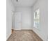 Cozy bedroom featuring neutral carpeting, a bright window and ample natural light at 416 Wilfawn Way, Avondale Estates, GA 30002