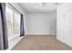 Bright bedroom with carpet, white walls, ceiling fan and a large window at 416 Wilfawn Way, Avondale Estates, GA 30002