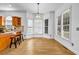 Cozy breakfast nook with hardwood floors and large windows providing ample sunlight at 416 Wilfawn Way, Avondale Estates, GA 30002