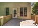 Back deck with access to the home and featuring a view of the yard with mature landscaping at 416 Wilfawn Way, Avondale Estates, GA 30002