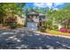 Charming two-story home with a brick and siding exterior, a two-car garage, and a well-maintained front yard at 416 Wilfawn Way, Avondale Estates, GA 30002