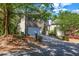 Two-story home with a two-car garage, brick and siding exterior, and mature landscaping, set on a treed lot at 416 Wilfawn Way, Avondale Estates, GA 30002