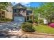 Charming two-story home with brick and siding, a well-manicured lawn, and an inviting entrance at 416 Wilfawn Way, Avondale Estates, GA 30002