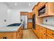 Gourmet kitchen featuring stainless steel appliances, granite countertops, double ovens, and wood cabinets at 416 Wilfawn Way, Avondale Estates, GA 30002