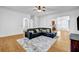 Open-concept living room with hardwood floors, crown molding, and ample natural light at 416 Wilfawn Way, Avondale Estates, GA 30002