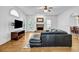Inviting living room featuring hardwood floors, fireplace, and TV on wall for modern entertainment at 416 Wilfawn Way, Avondale Estates, GA 30002