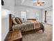 Spacious main bedroom featuring trey ceiling, carpeted floors, with natural lighting at 416 Wilfawn Way, Avondale Estates, GA 30002