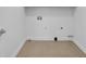 Clean and simple utility room featuring a tile floor and utility connections at 416 Wilfawn Way, Avondale Estates, GA 30002