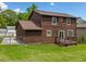 Spacious fenced-in backyard with a deck, offering privacy and room for outdoor activities at 893 Sandune Dr, Norcross, GA 30093