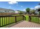 Inviting backyard view with a wooden deck and green lawn, great for outdoor relaxation at 893 Sandune Dr, Norcross, GA 30093
